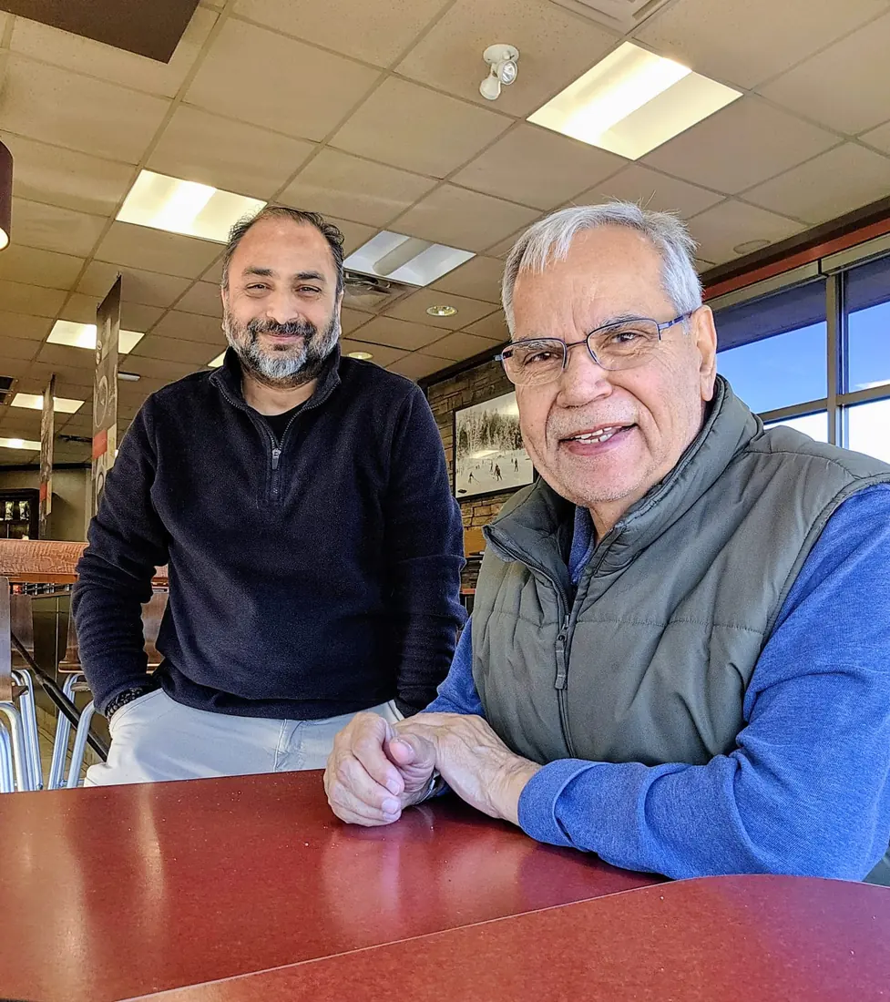 Husain meeting with a community elder