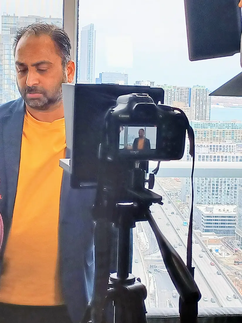Husain being interviewed on camera