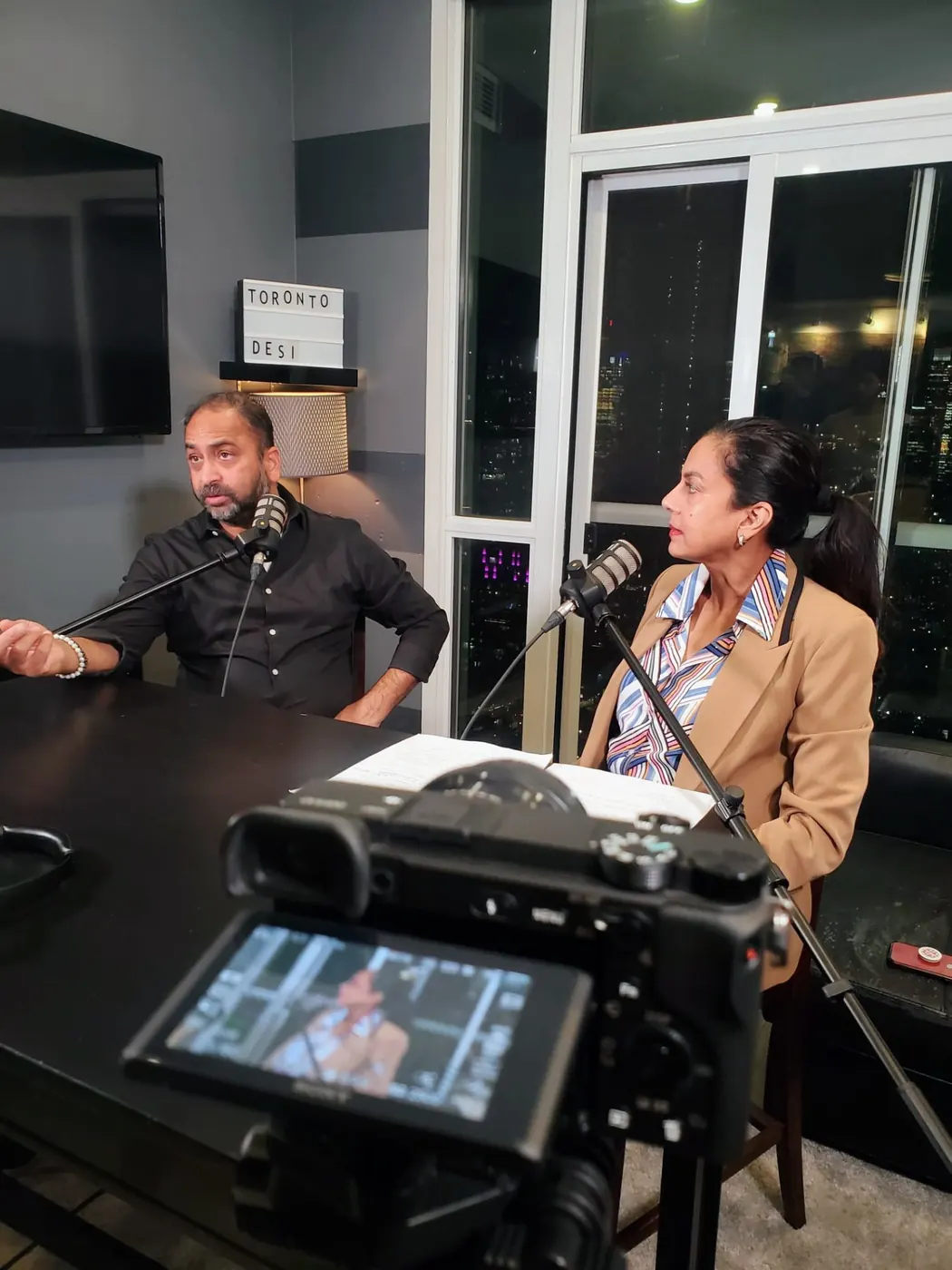 Husain on a podcast